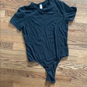 V/S  bodysuit. Black with subtle floral design